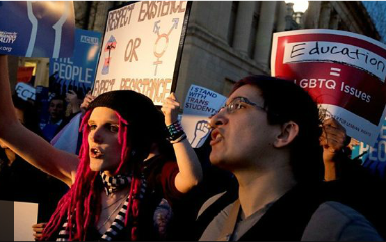 Transgender rights activists protested near the White House against President Trump's decision on Wednesday