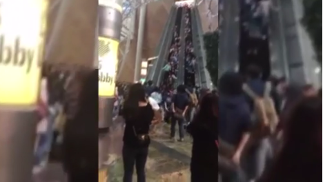 Escalator malfunction injures dozens