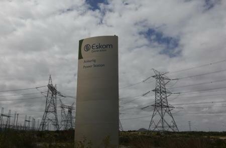 Pylons carry electricity from a sub-station of state power utility Eskom outside Cape Town in this picture taken March 20, 2016. REUTERS/Mike Hutchings