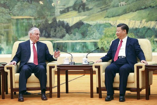 U.S. State of Secretary Rex Tillerson, left, chats with China's President Xi Jinping at the Great Hall of the People in Beijing, China, Sunday, March 19, 2017. (Lintao Zhang/Pool Photo via AP)